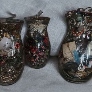 Assorted Jewelry in Glass Vases